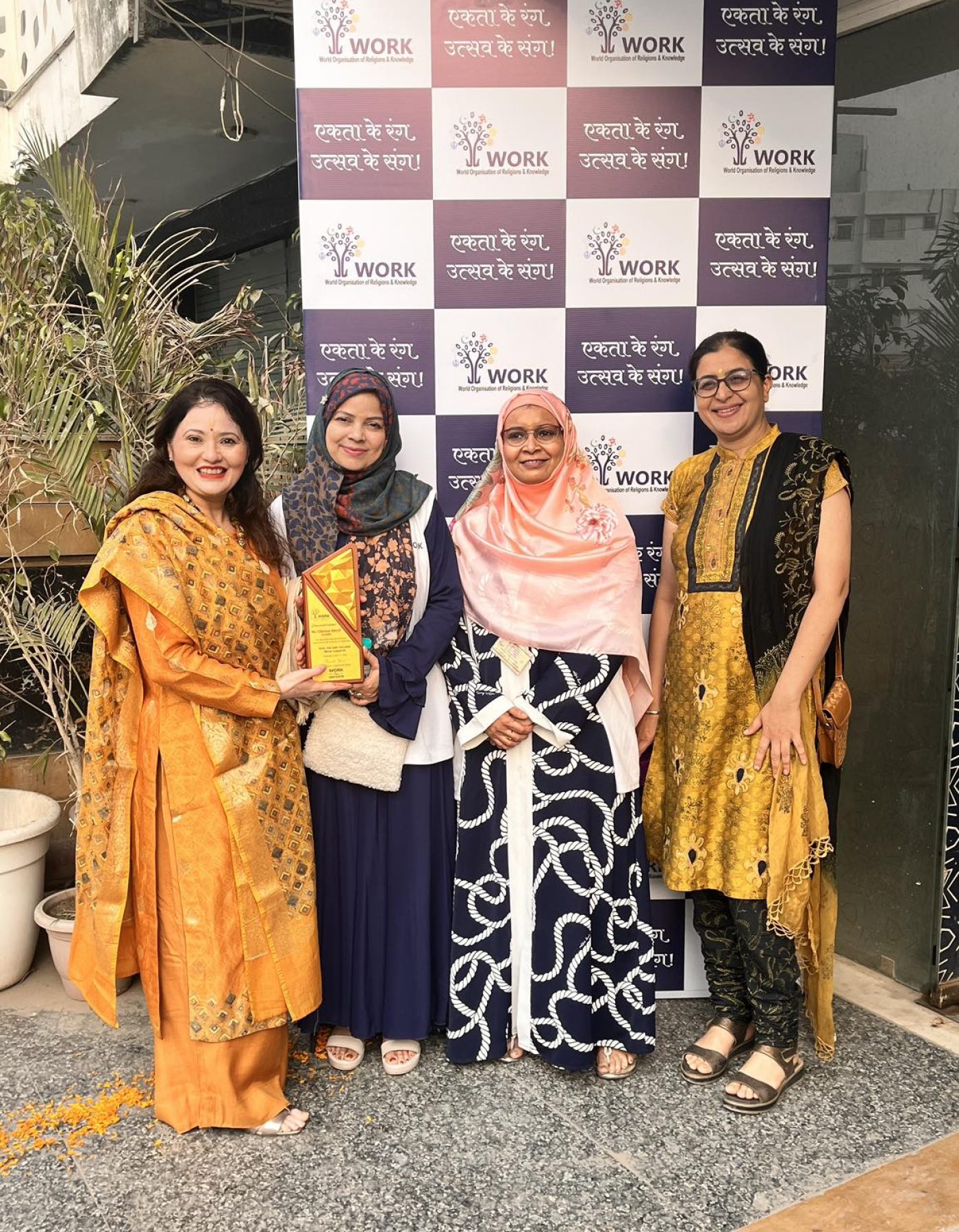 Founders posing with a trophy